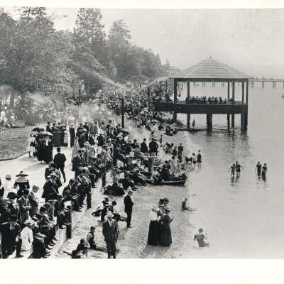 Crowd of people along boardwalk at Alki Beach