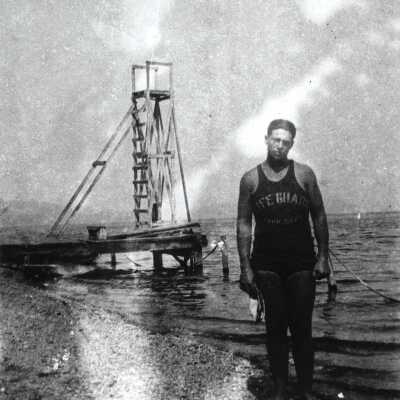Hess Viney, wearing lifeguard swimsuit
