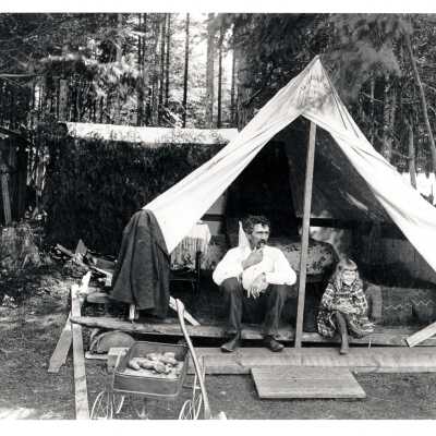Man and Girl outside tent