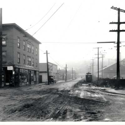 Muddy street in front of Youngstown Mercantile Co.