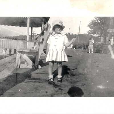Female child on next to Alki Bandstand on walk.