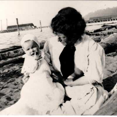 Woman with infant at Alki Beach.