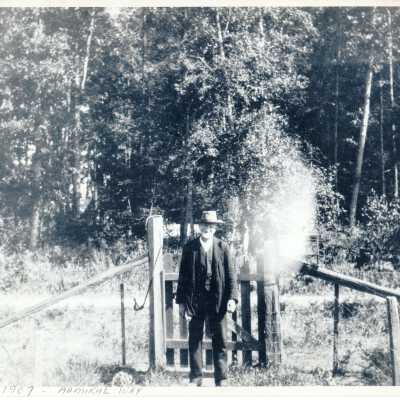 Admiral District, Photo of man in front of gate.