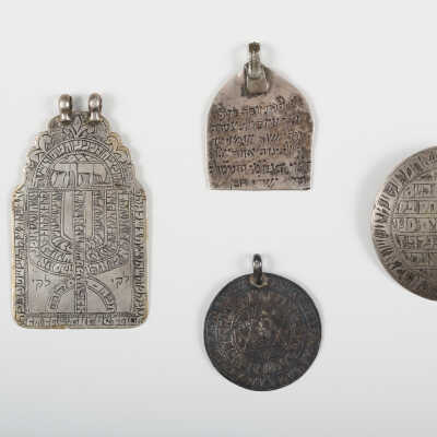 Set of four amulets