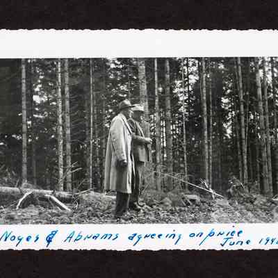 Photograph of two men, Noyes and Abrams, in woods