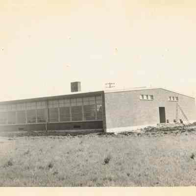 Photograph of a school building, 1940s