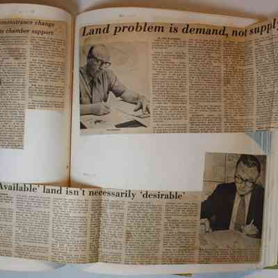 Page 113 unfolded newspaper clippings