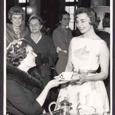 Photograph of Mrs. Mark Hatfield serving tea to unknown young lady. Date unknown.
