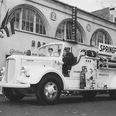 Photograph of white Springfield Fire Dept. truck in parade in Eugene, Oregon, 1947