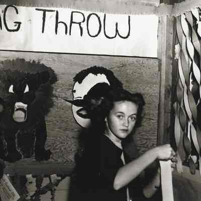 Photograph of students setting up bean bag game at Springfield High carnival, Springfield, Oregon, circa 1940s