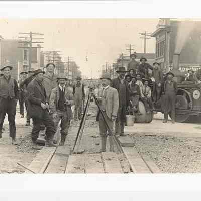 Photograph of Elmer E Kepner and transit crew paving Main Street, circa 1911