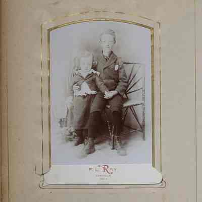 2016-024-012_img-019: Page 17 of photograph album 2016.024.012: Photo of two unknown young boys setting on a bench.