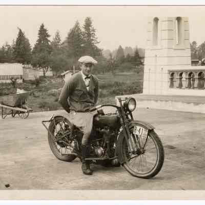 Photograph of Bill Davis on a motorcycle, new bridge in Springfield, 1926