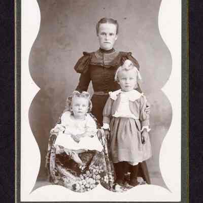 Photograph of a women with two children