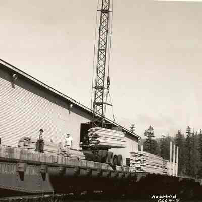 Photograph of Workers Loading Flatcars with Lumber, Undated