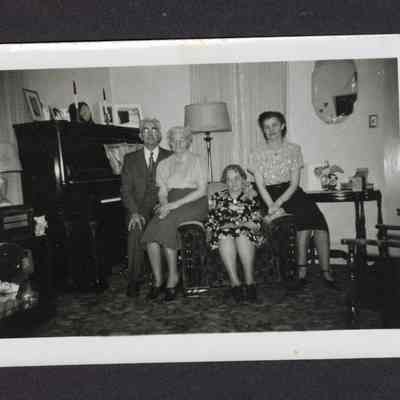 Photograph of Charles H Myers, Hattie Myers, an aunt and Doris Myers in a living room, circa 1940