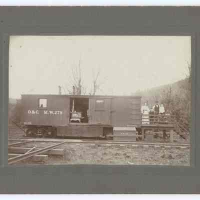 Photograph of the Skelly family next to their railcar house and contextual letter by daughter, circa 1910