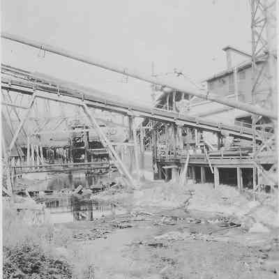 Photograph of mill creek between Booth Kelly Mill and the powerhouse burner, Wendling, Oregon, circa 1920s