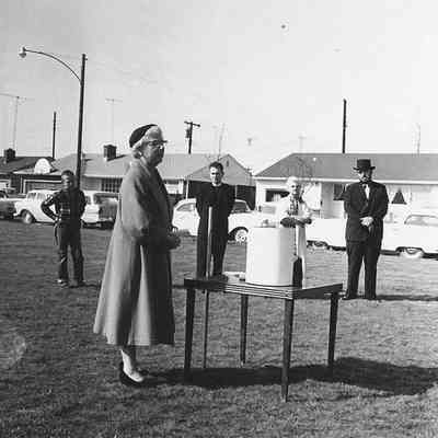 Photograph of five people with Oregon Centennial time capsule, 1959.