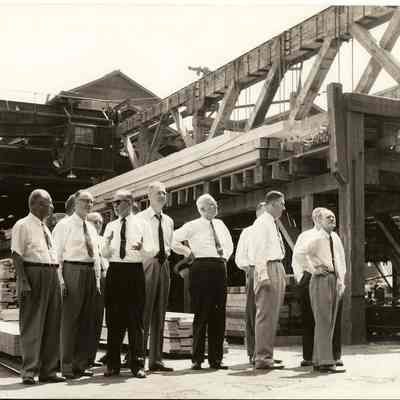 Photograph of 11 Men in a Lumber Yard, Undated