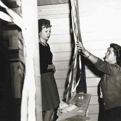 Photograph of two students setting up for the Springfield High Carnival, Springfield, Oregon, circa 1940s