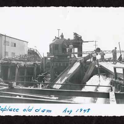 Photograph of the replacement of the old dam at Booth-Kelly Lumber Mill
