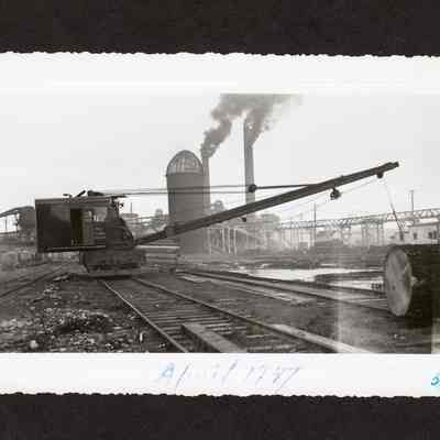 Photograph of rail crane for lifting logs, at Booth-Kelly Mill