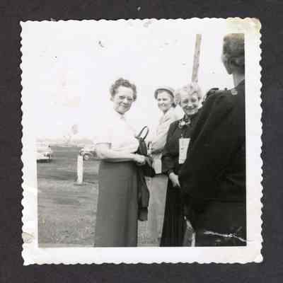 Photograph of Doris and Mae/Leona Myers, at a race track, circa 1940