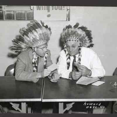 Photograph of men wearing Native American headdresses, McKenzie Willamette Hospital, 1953