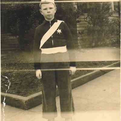 Young Boy in Junior Police Uniform; 1947.