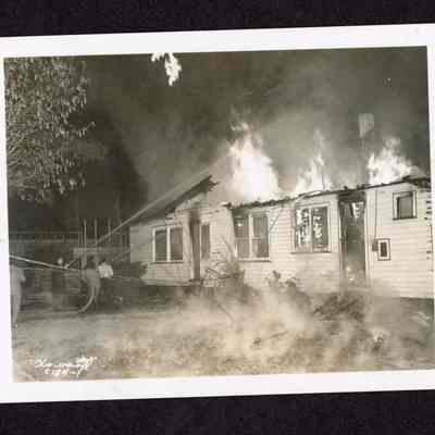 Photograph of a burning house