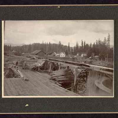Photograph of the end of the Fischer Mill lumber flume, Marcola, Oregon, circa 1903-1905
