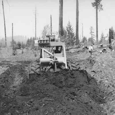 Photograph of Tractor Blading Dirt