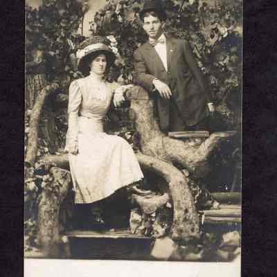Photograph on postcard of unknown man and women