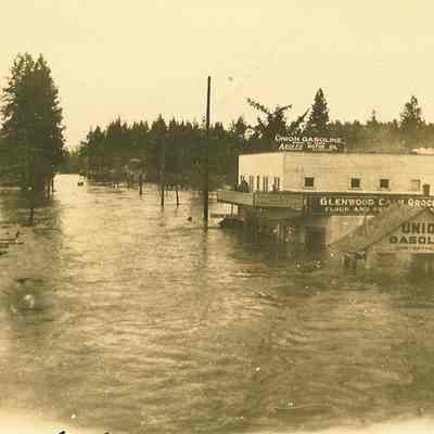 Photograph of Union Gasoline Station and Glenwood Cash Grocery in Flood, Glenwood, OR, 1927