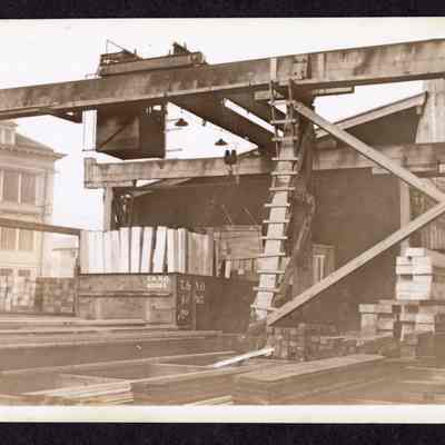 Photograph on postcard of loading car of ties at Jones Lumber Co., Portland, Oregon, date unknown