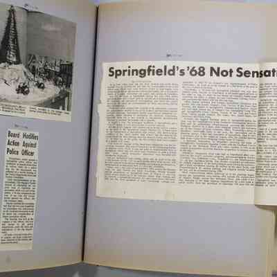 Pages 82-83 newspaper clipping unfolded
