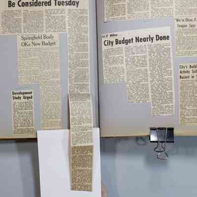 Pages 118-119 newspaper clipping unfolded