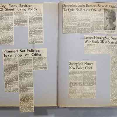 Pages 142-143 newspaper clipping unfolded