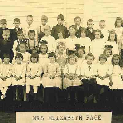Photograph of elementary students with teacher Elizabeth Page, Springfield, Oregon, date unknown.