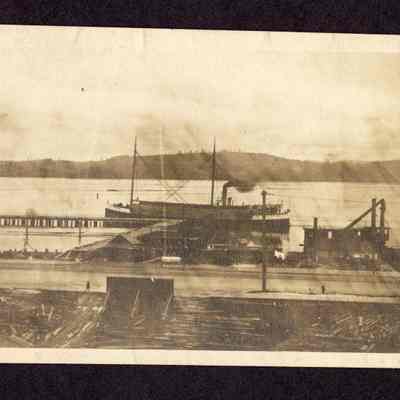 Photograph of a Freighter at dock, 2-masted, date unknown