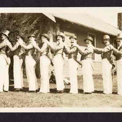Photograph of 11 people dressed in costume, date and location unknown