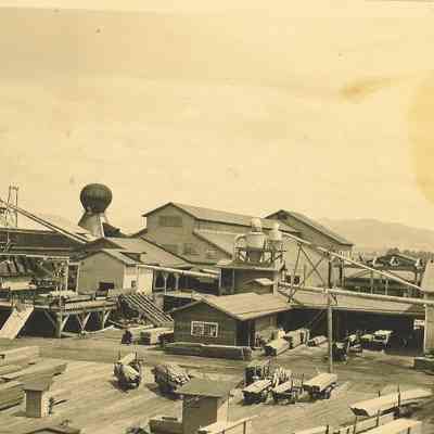 Photograph of a lumber yard and Booth-Kelly Mill