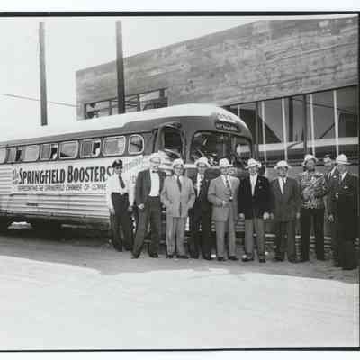 Photograph of people posing in front of a bus, "Springfield Boosters", Chamber of Commerce, Springfield, circa 1950