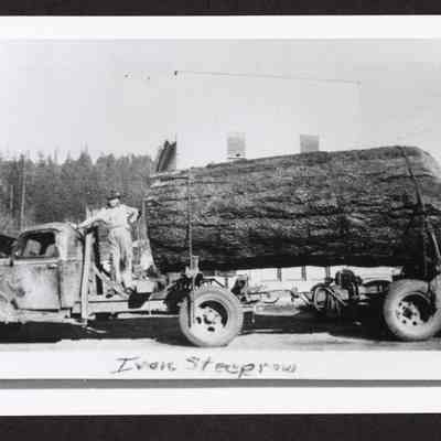 Photograph of Ivan Steeprow standing on log truck, Marcola, Oregon