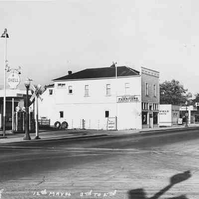 Photograph of buildings on Main Street between 3rd and 2nd streets, Springfield, Oregon, 1946.