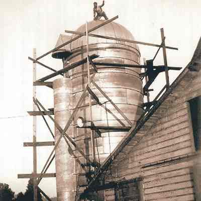 Photograph of Eddy Relyea on a Silo with Scaffolding, Circa 1950