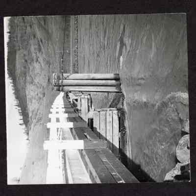 Photograph of bridge over river, unknown area. Date unknown.