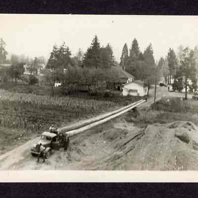 Photograph of Four People with Truck pulling Spar Pole, circa 1930
