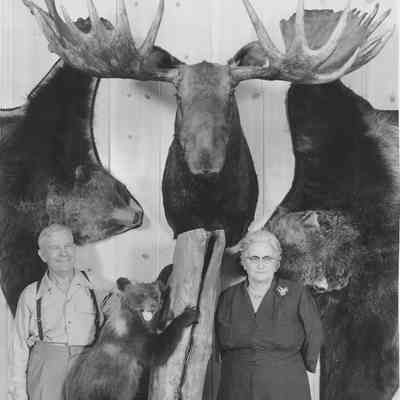 Photograph of Daisy and Fred Hills in their Trophy Room, Jasper, Oregon, undated